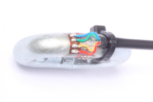 Chain link load sensor after wiring loom has been soldered into place